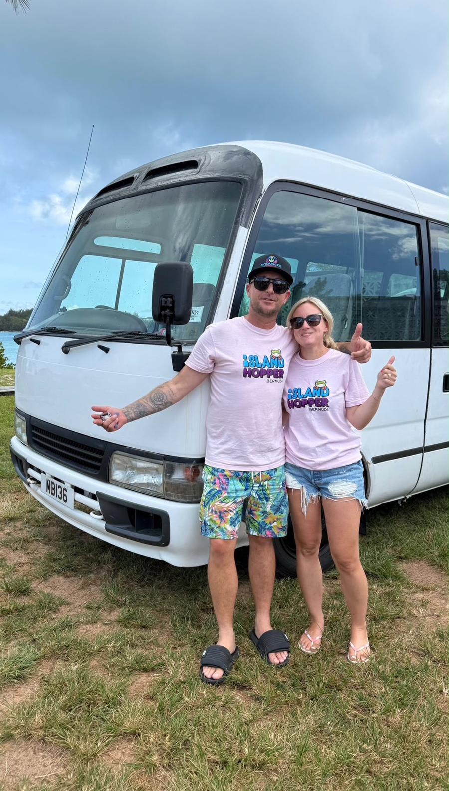 Bradley and Tina standing in front of the Island Hopper bus